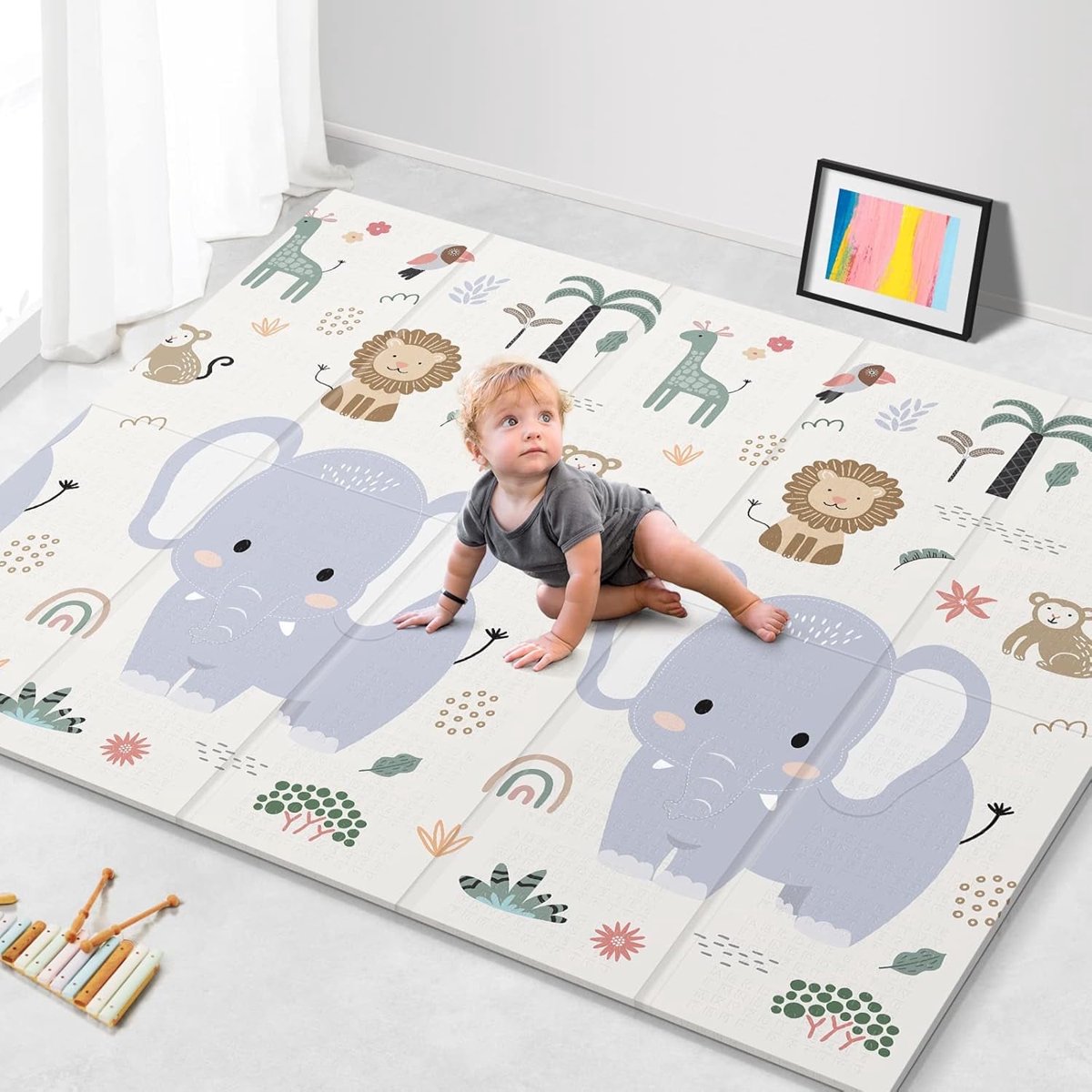 Foldable baby play mat in a family room